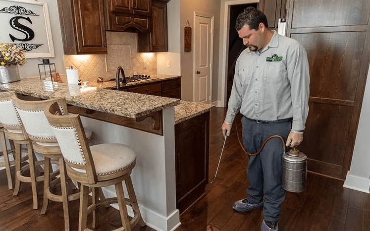 image of exterminator in a kitchen